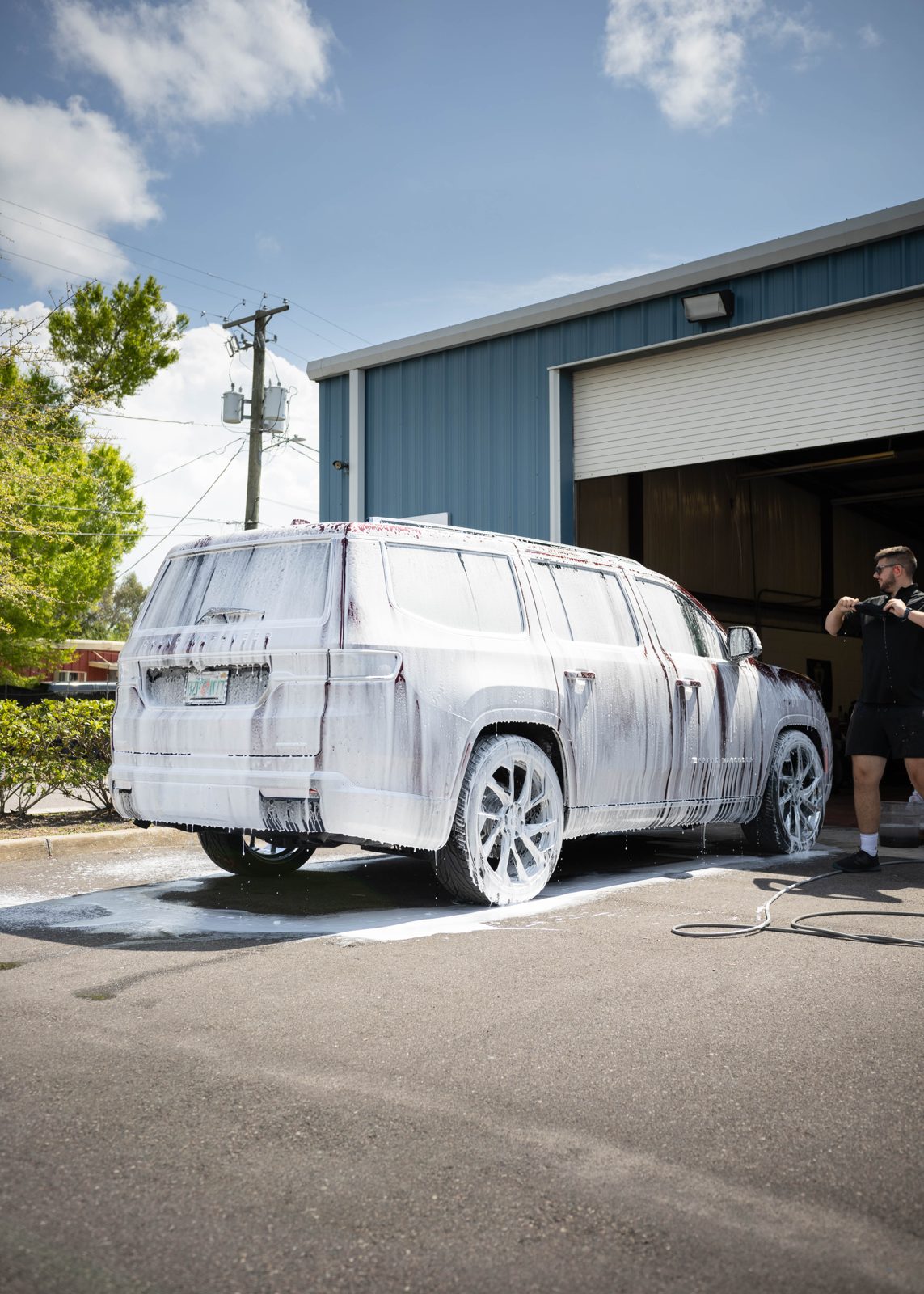 Large white vehicle detailed for oxidation and roof care near Durham, NC