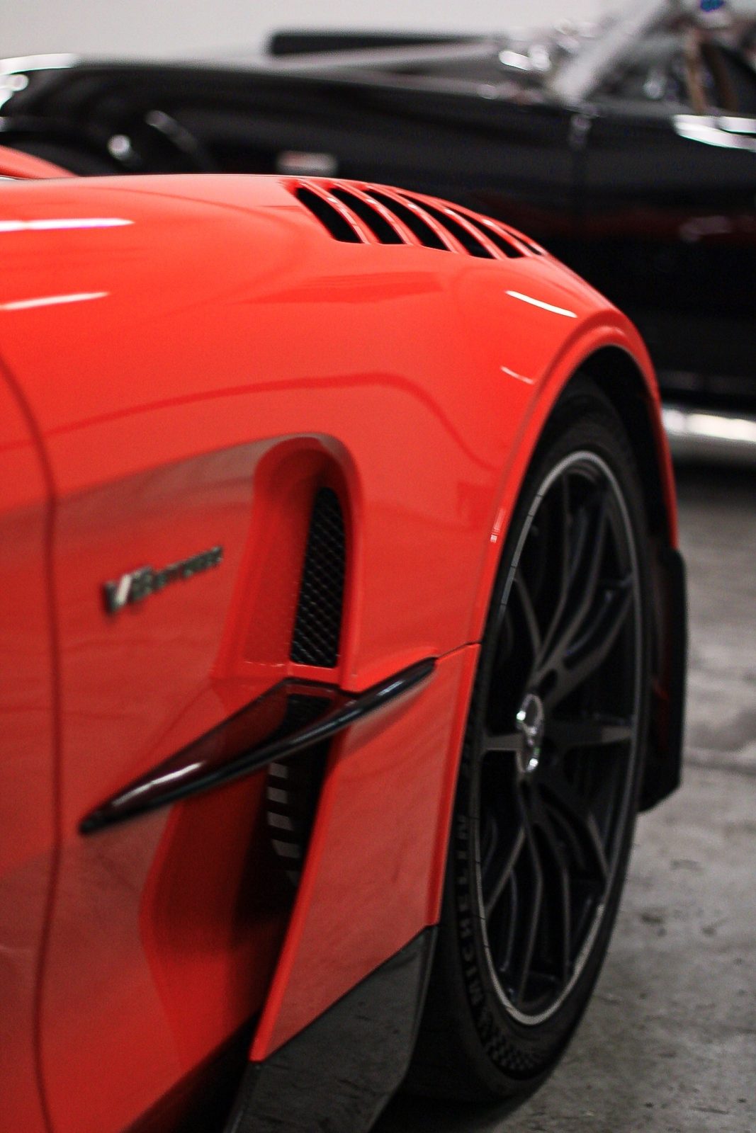 Detailed sports car finish shown on a large-vehicle job near Falls Lake
